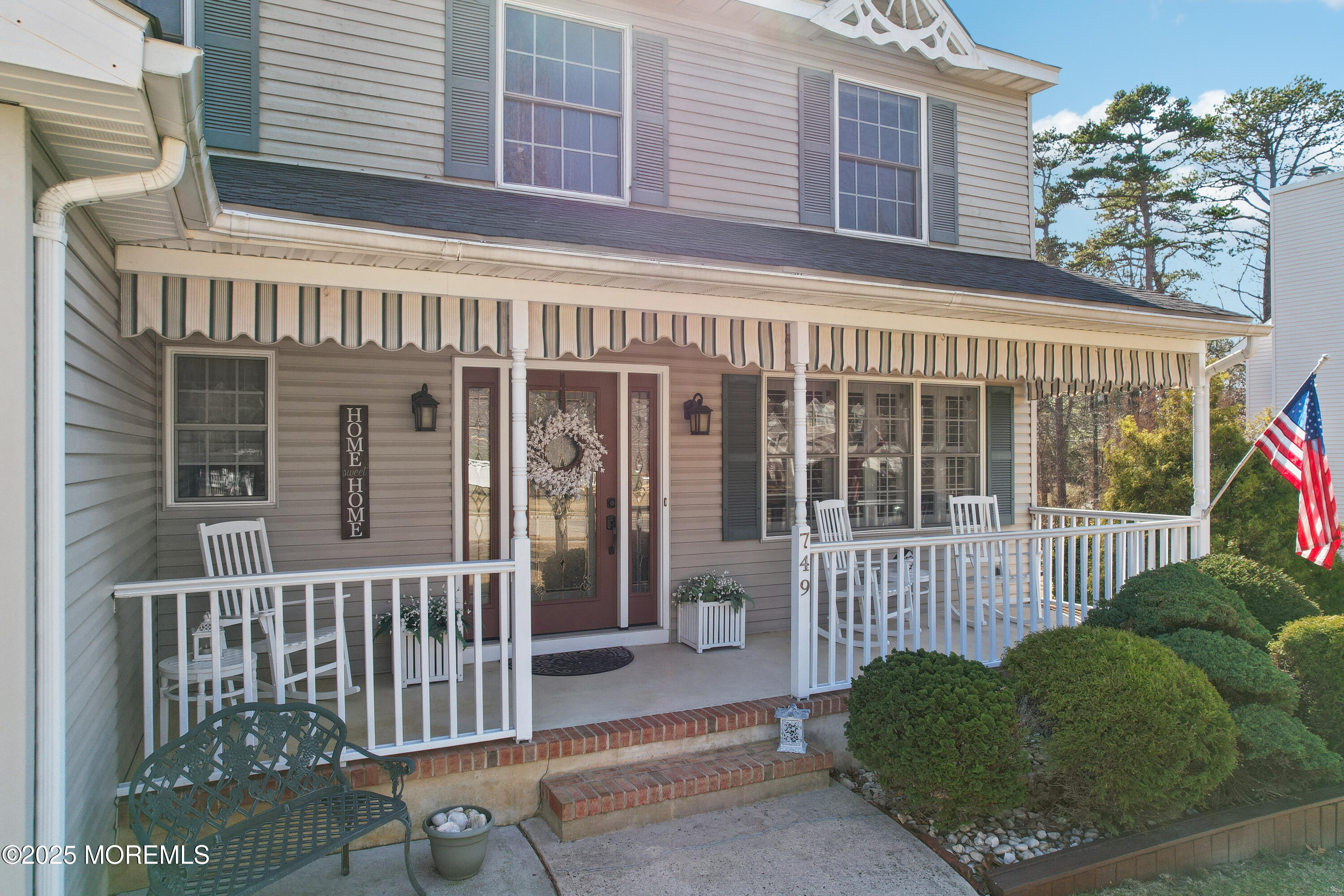 749 Rabbit Run Brick, NJ 08724 - Photo 3 of 43 a front view of a house with a porch