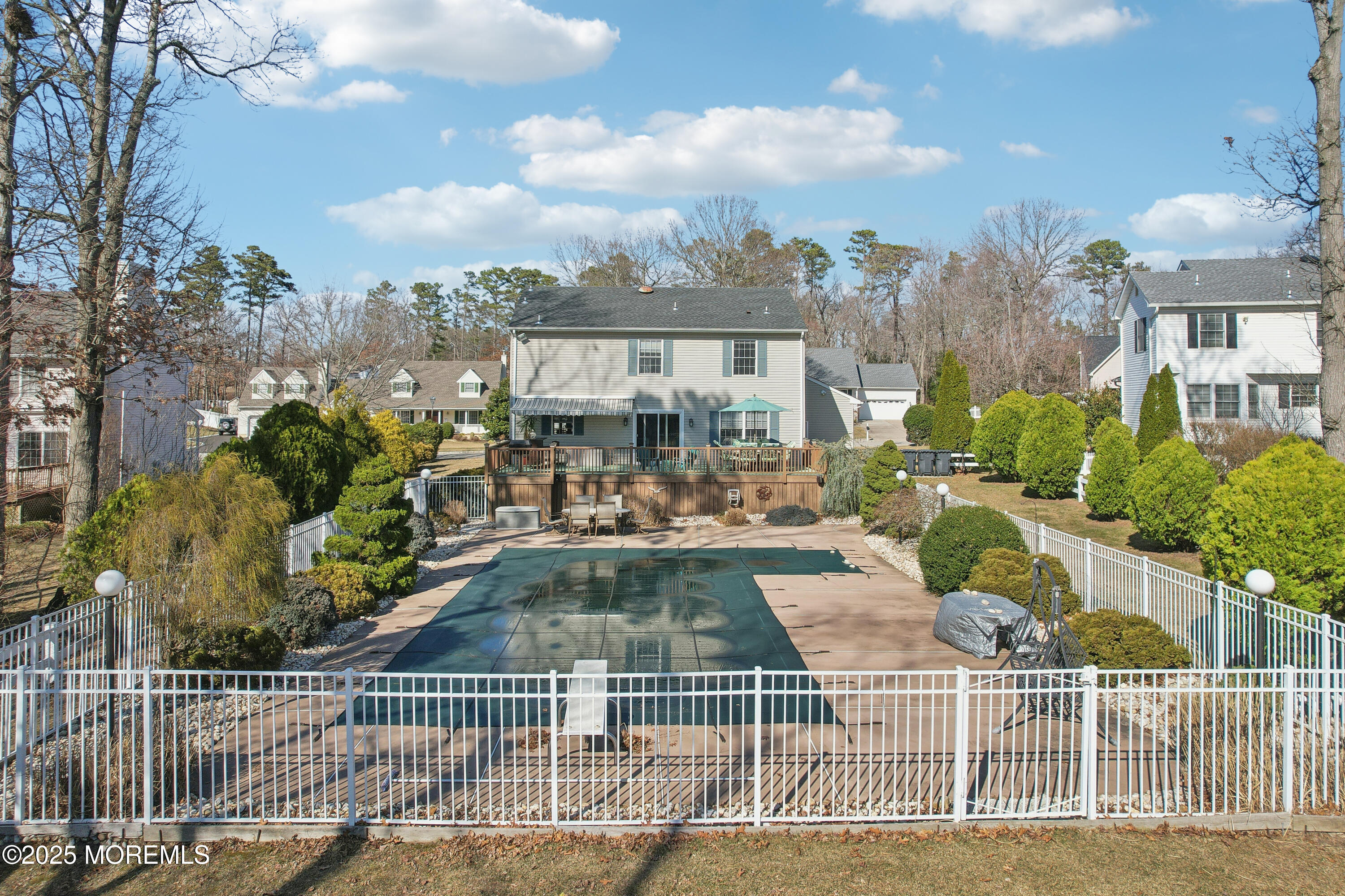 749 Rabbit Run Brick, NJ 08724 - Photo 35 of 43 a view of a patio with couches table and chairs and potted plants