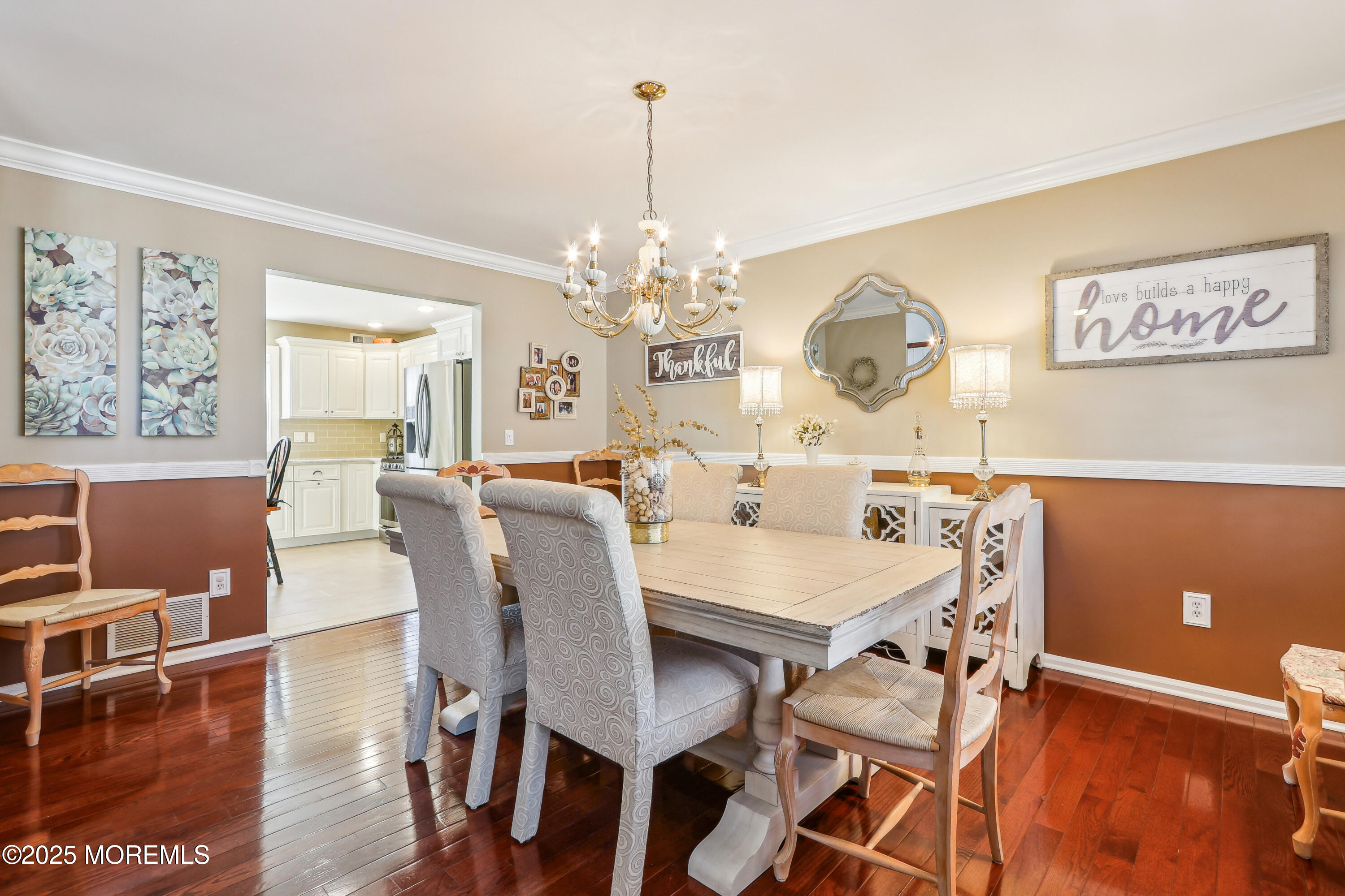 749 Rabbit Run Brick, NJ 08724 - Photo 5 of 43 a view of a dining room with furniture wooden floor and chandelier