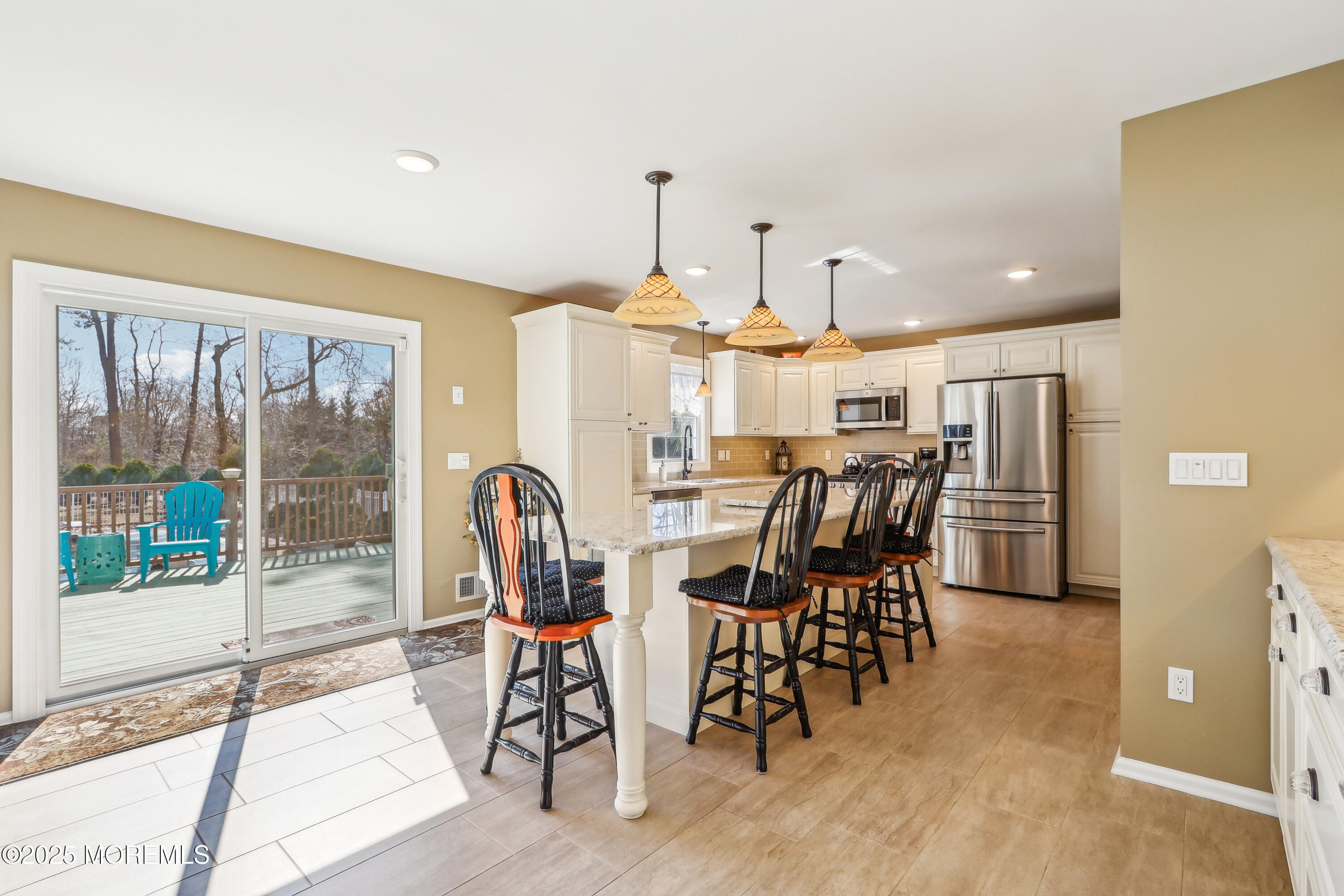 749 Rabbit Run Brick, NJ 08724 - Photo 10 of 43 a dining room with furniture a chandelier and wooden floor