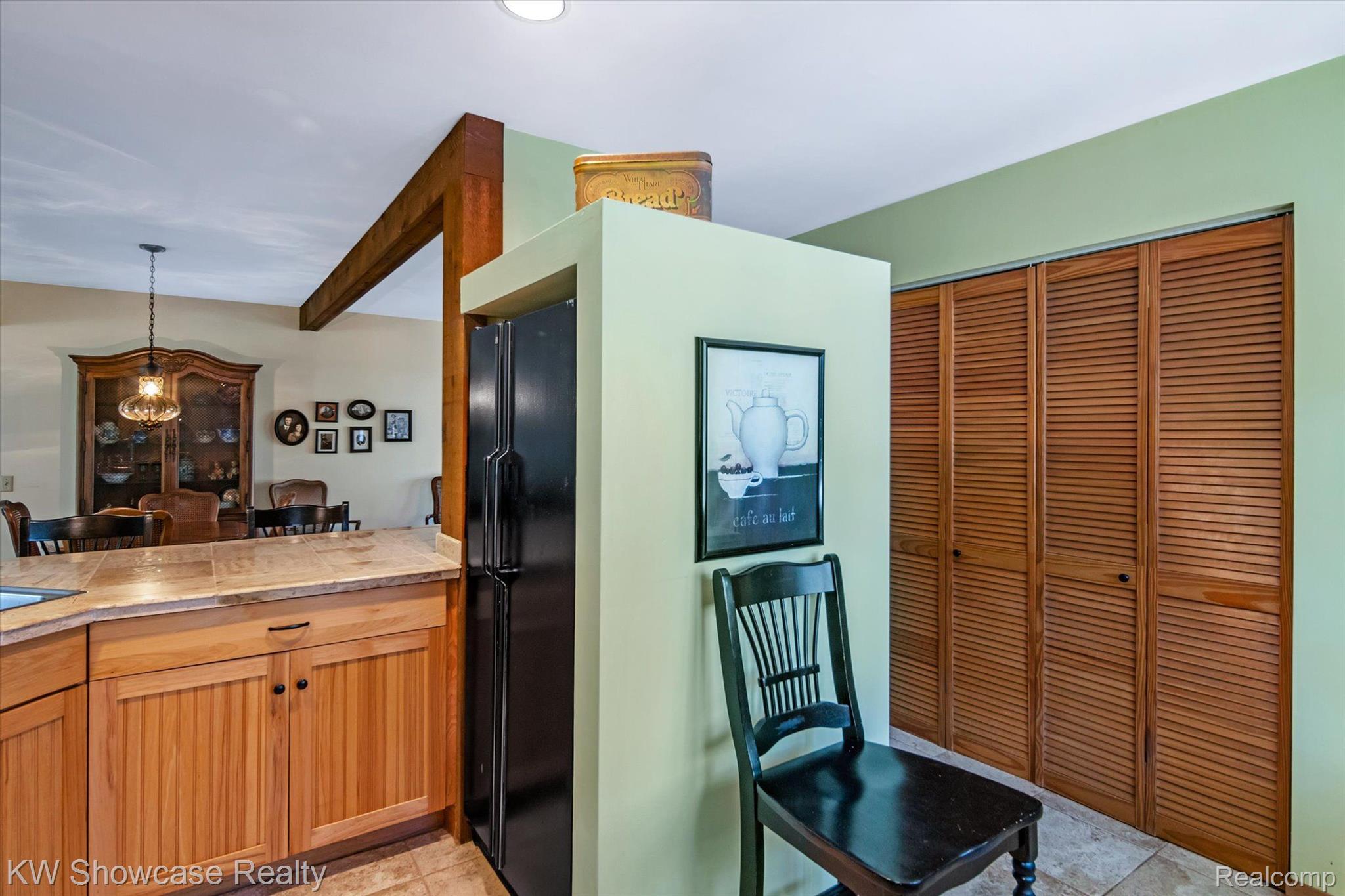 9220 Mcgregor Road Pinckney, MI 48169 - Photo 14 of 40 The washer & dryer are behind those bifold doors.