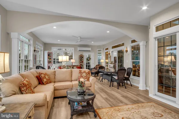 a living room with furniture a rug and a fireplace