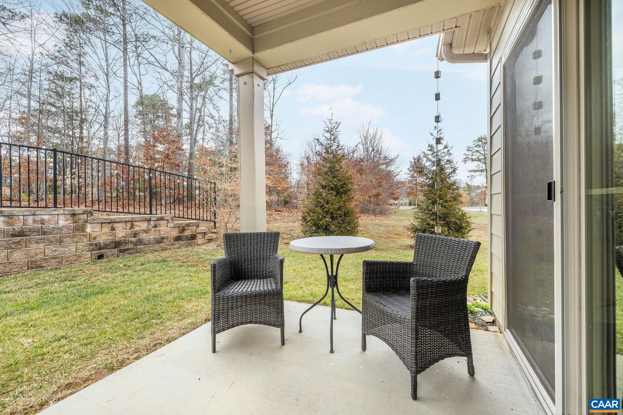 360 Winding Road Keswick, VA 22947 - Photo 47 of 48 a view of a patio with a table and chairs