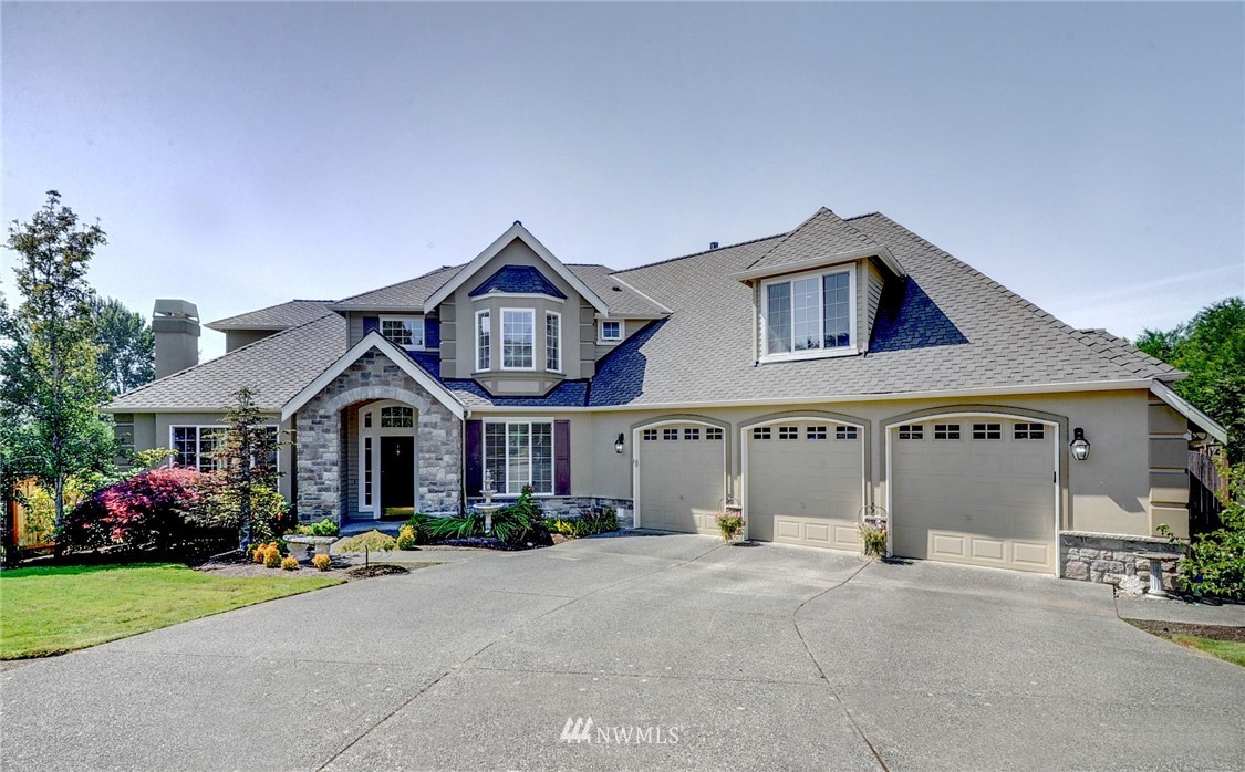 24204 21st Drive Southeast Bothell, WA 98021 - Photo 1 of 39 a front view of a house with garden