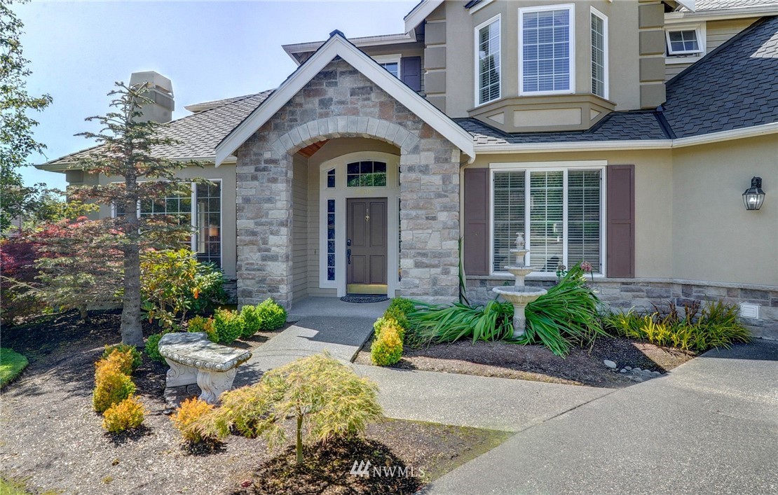 24204 21st Drive Southeast Bothell, WA 98021 - Photo 2 of 39 a front view of a house with a yard