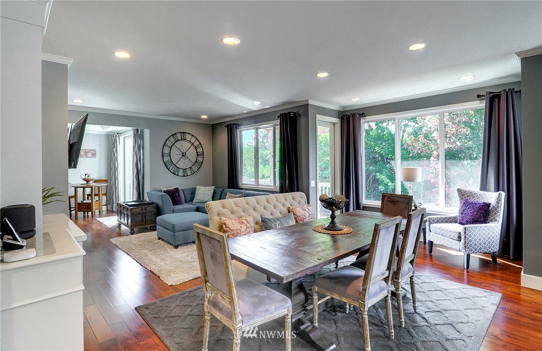 24204 21st Drive Southeast Bothell, WA 98021 - Photo 11 of 39 a view of a dining room with furniture window and wooden floor