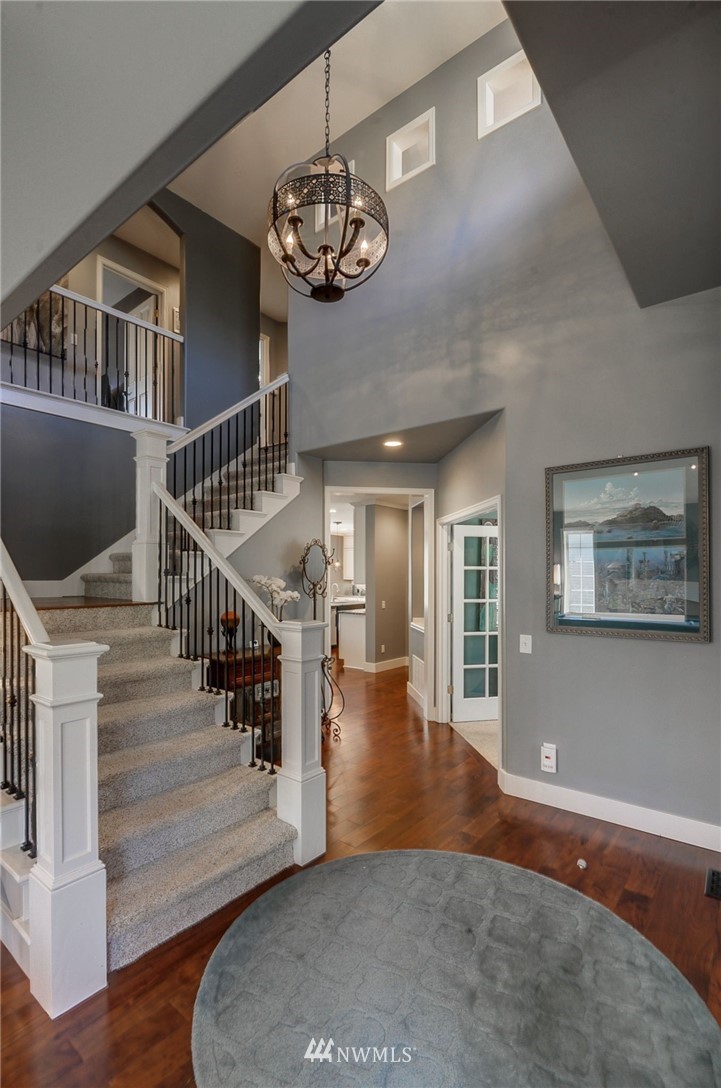 24204 21st Drive Southeast Bothell, WA 98021 - Photo 3 of 39 a view of a hallway with wooden floor and staircase