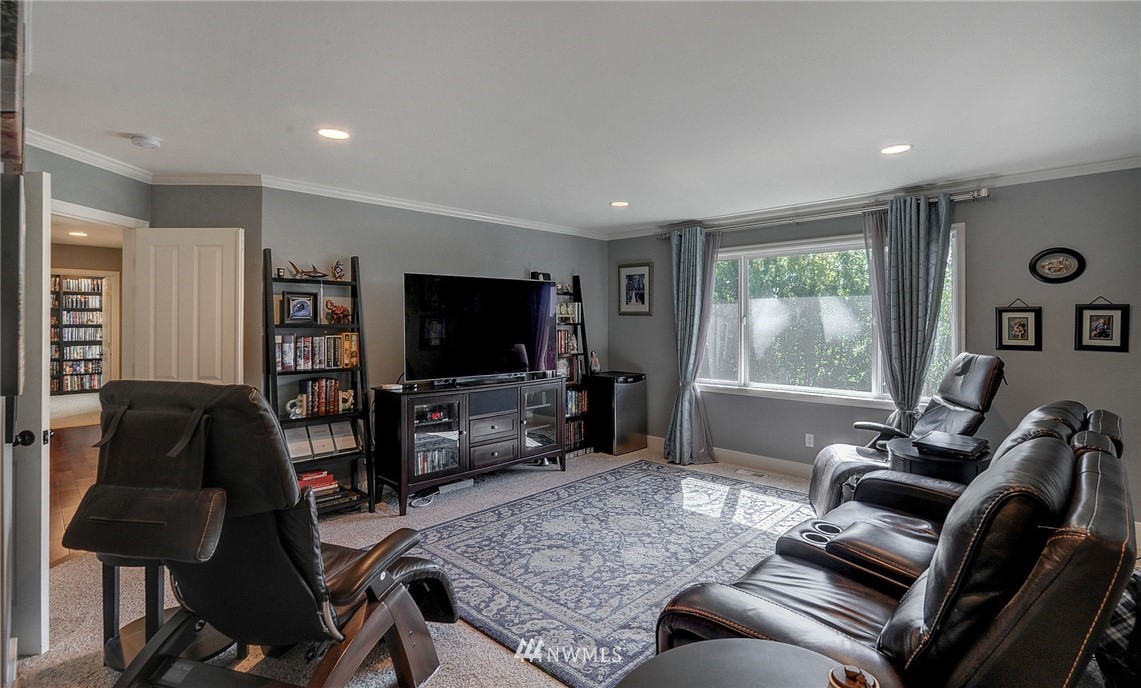 24204 21st Drive Southeast Bothell, WA 98021 - Photo 21 of 39 a living room with furniture and a flat screen tv