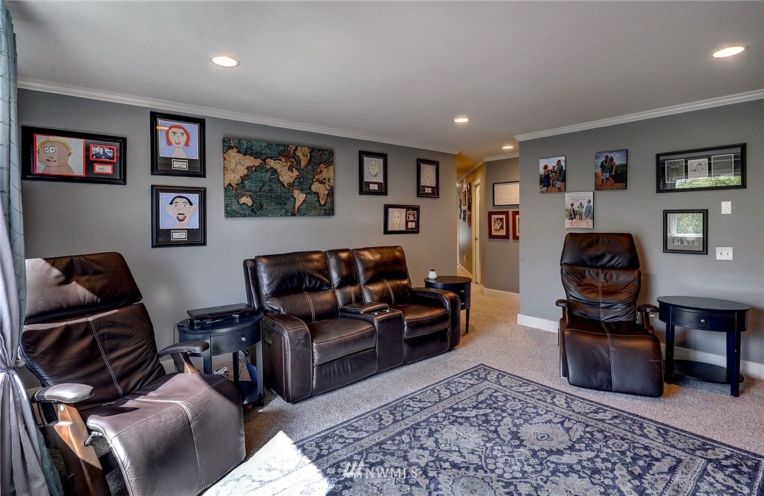 24204 21st Drive Southeast Bothell, WA 98021 - Photo 22 of 39 a living room with furniture and a flat screen tv