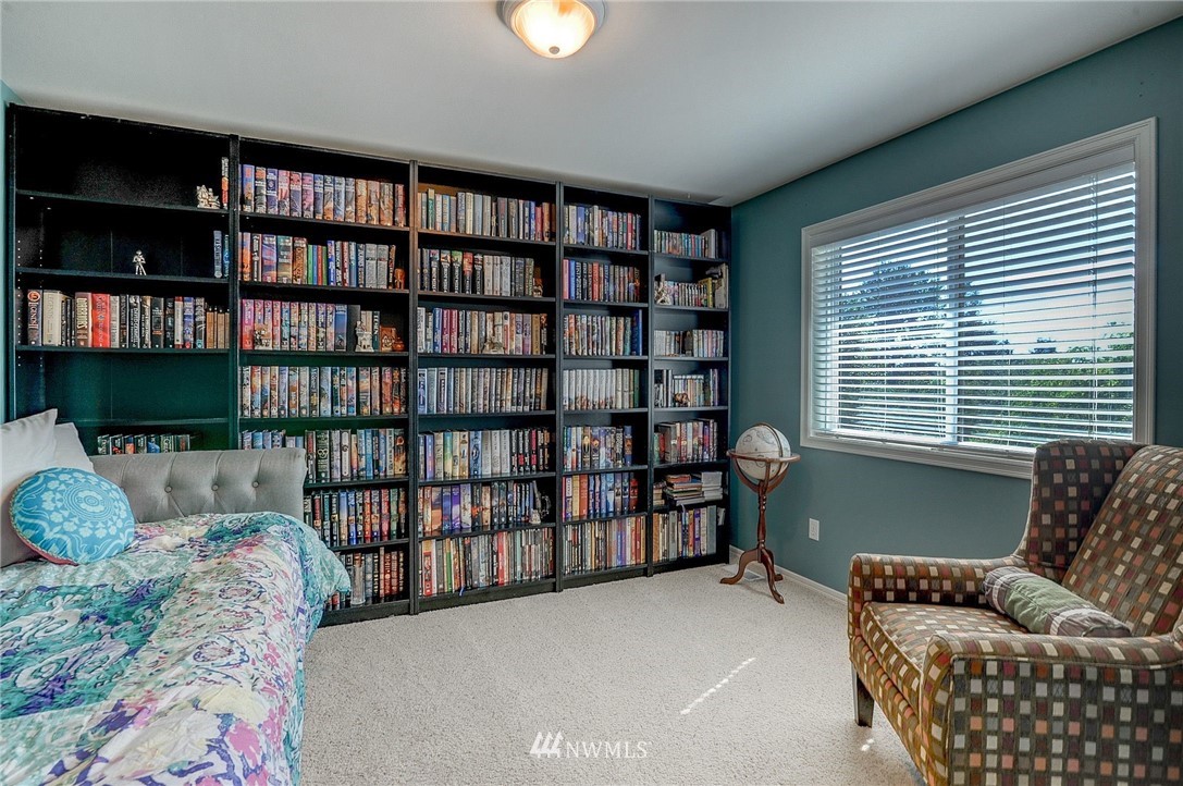 24204 21st Drive Southeast Bothell, WA 98021 - Photo 29 of 39 a living room with furniture and a book shelf