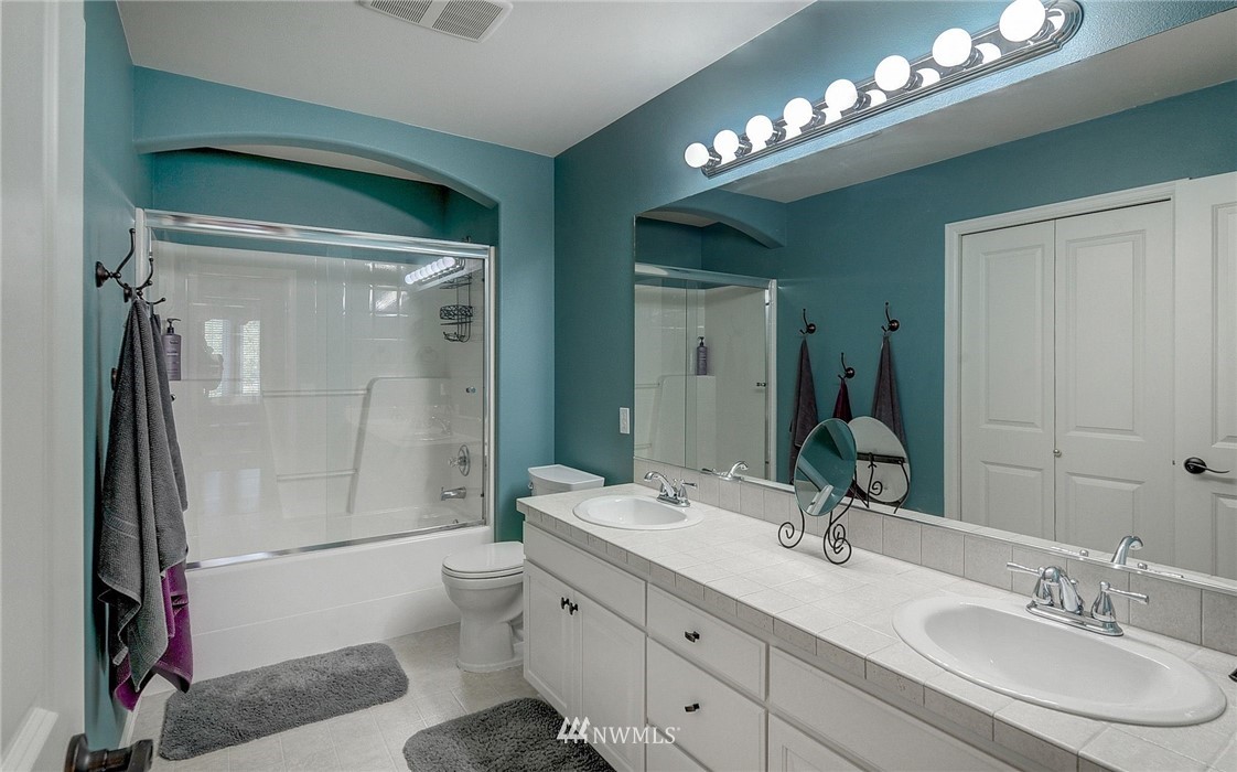 24204 21st Drive Southeast Bothell, WA 98021 - Photo 31 of 39 a bathroom with a sink a toilet and shower