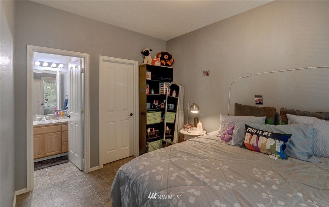24204 21st Drive Southeast Bothell, WA 98021 - Photo 34 of 39 a bed room with a bed and a cabinets