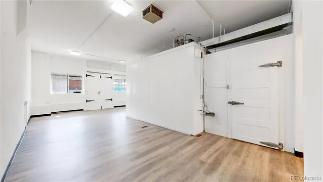 a view of a livingroom with wooden floor