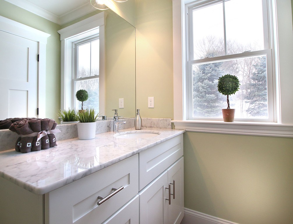 44 Howland Street Needham, MA 02492 - Photo 15 of 18 a bathroom with a granite countertop sink and a window