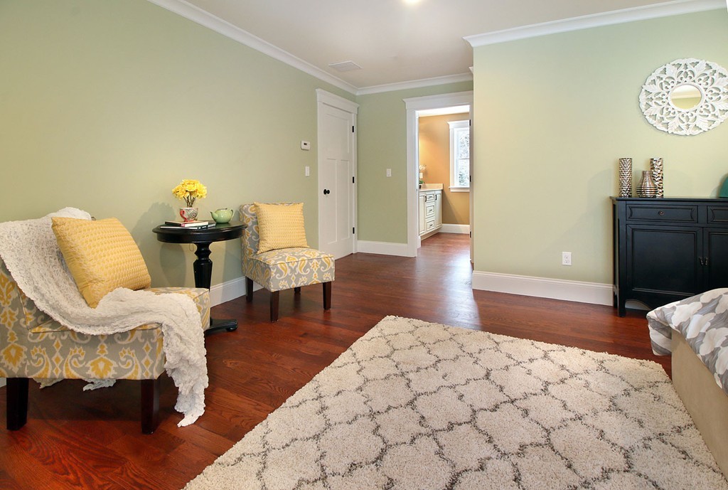 44 Howland Street Needham, MA 02492 - Photo 4 of 18 a bedroom with furniture and a wooden floor