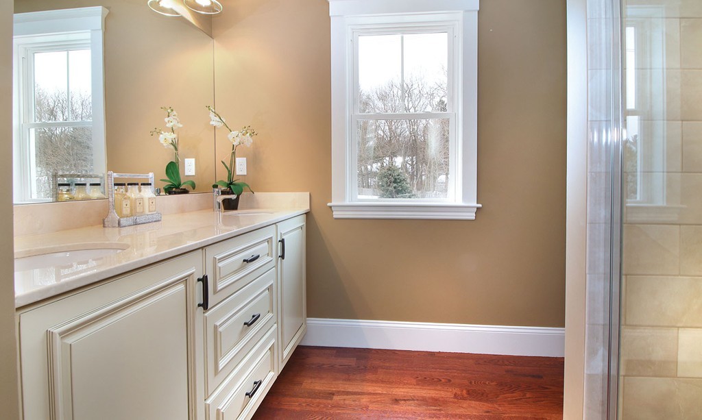 44 Howland Street Needham, MA 02492 - Photo 5 of 18 a bathroom with a granite countertop sink and a mirror