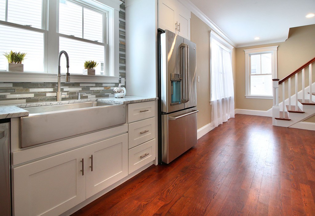 44 Howland Street Needham, MA 02492 - Photo 9 of 18 a kitchen with cabinets and wooden floor