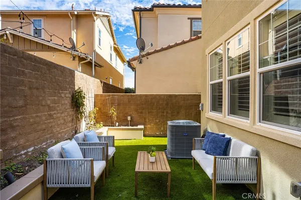 a view of house with patio and entertaining space