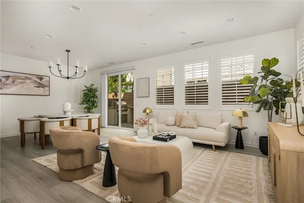 a living room with furniture and next to a window