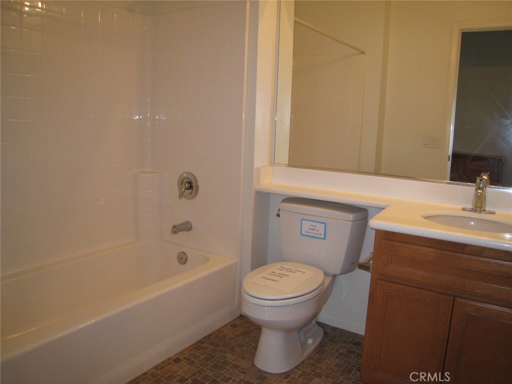 216 Dewdrop Irvine, CA 92603 - Photo 14 of 14 a bathroom with a sink a toilet and shower