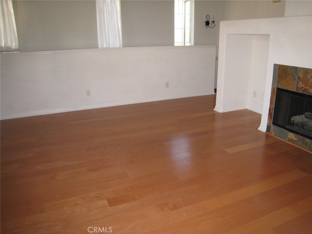 216 Dewdrop Irvine, CA 92603 - Photo 2 of 14 a view of a room with wooden floor and kitchen view
