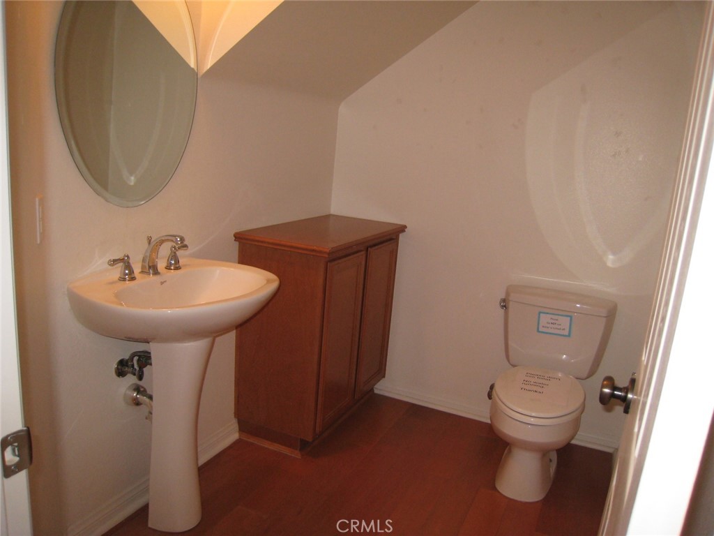 216 Dewdrop Irvine, CA 92603 - Photo 8 of 14 a bathroom with a sink toilet and a mirror