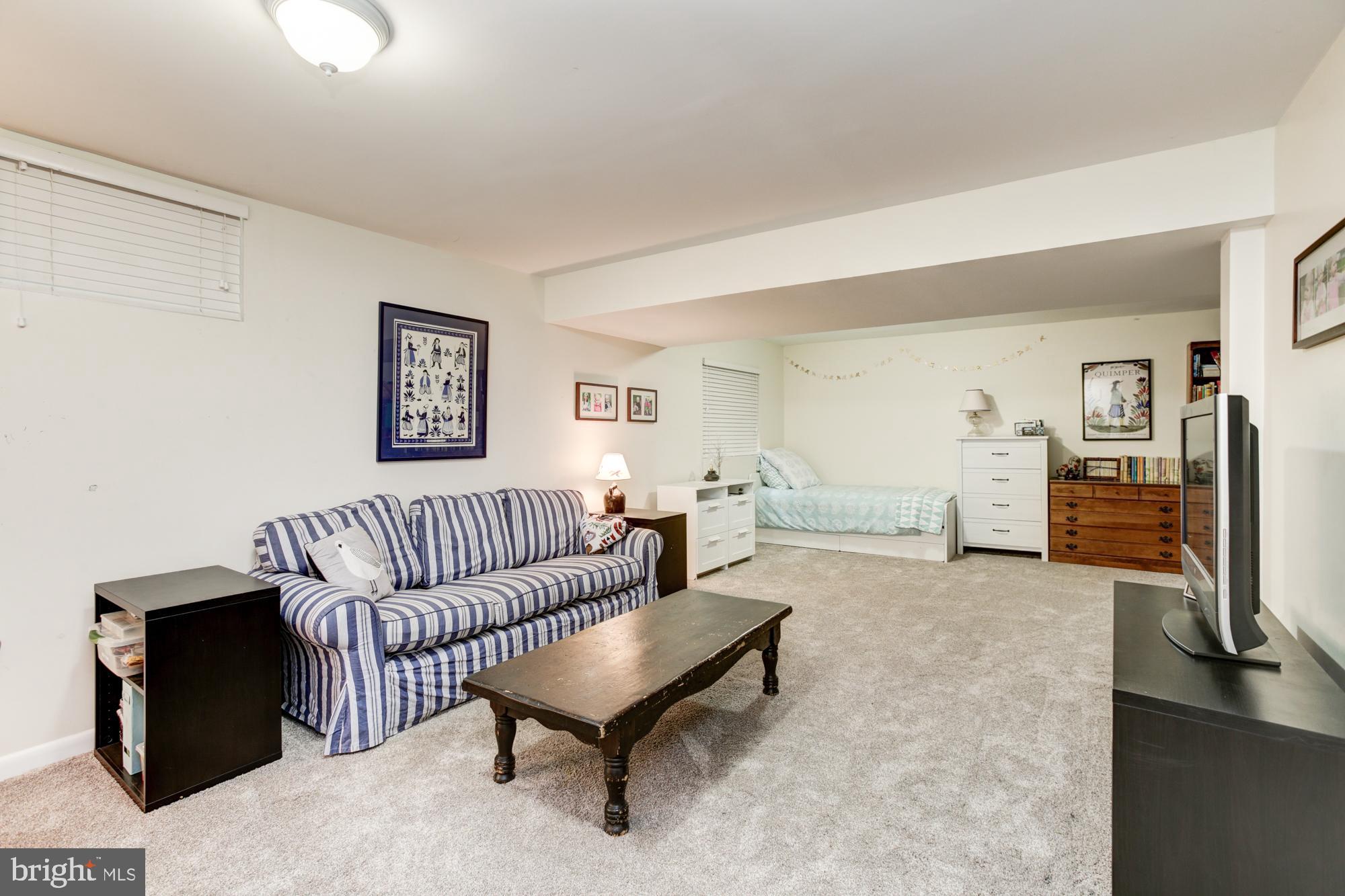 326 Riding Ridge Road Annapolis, MD 21403 - Photo 42 of 63 a living room with furniture and a wooden floor
