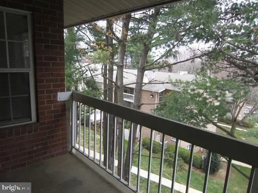 a view of a balcony with a pot