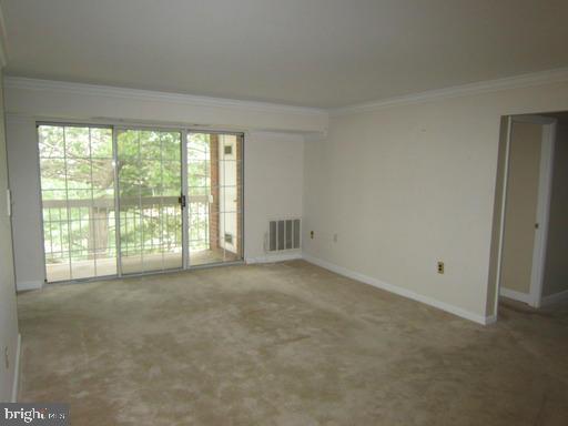 1921 Wilson Lane, Unit 303 McLean, VA 22102 - Photo 3 of 12 a view of an empty room with a window