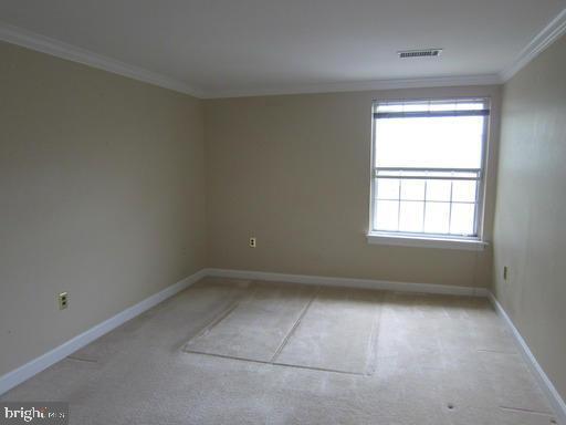 1921 Wilson Lane, Unit 303 McLean, VA 22102 - Photo 9 of 12 an empty room with a window