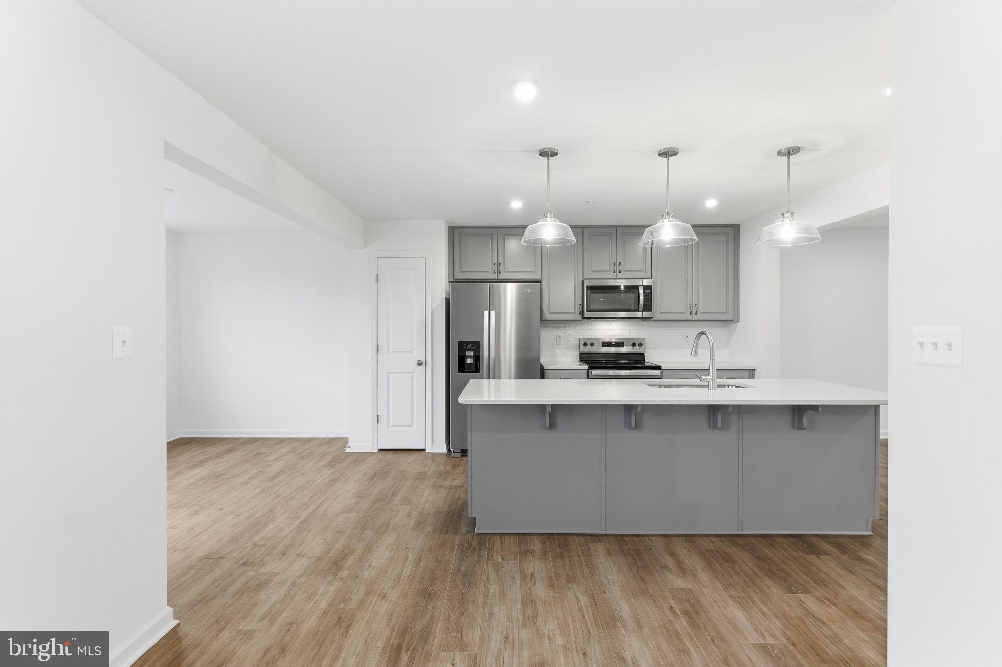 161 Homestead Drive Hanover, PA 17331 - Photo 5 of 43 a large kitchen with cabinets and wooden floor
