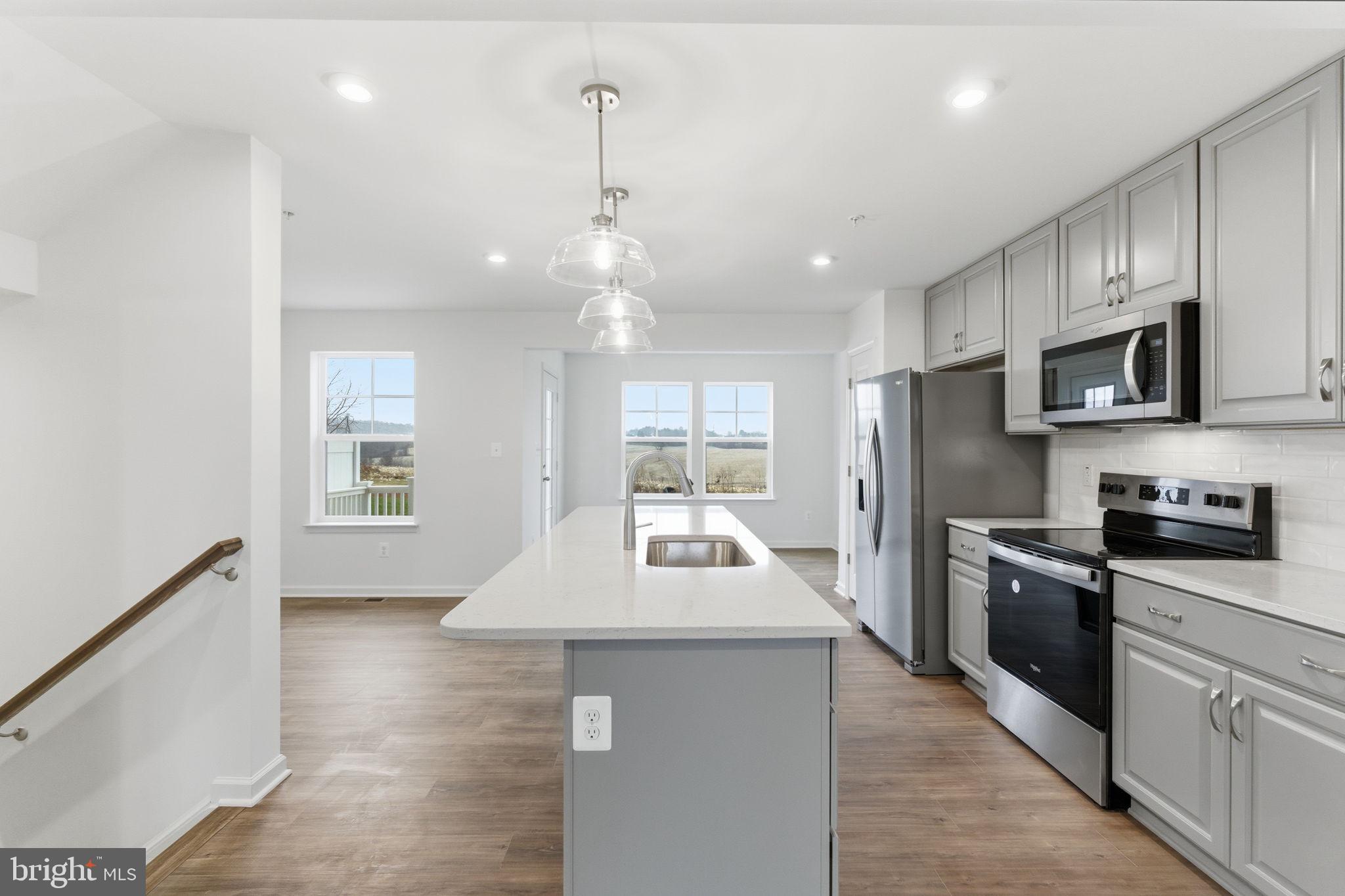 161 Homestead Drive Hanover, PA 17331 - Photo 6 of 43 a kitchen with kitchen island granite countertop a sink stainless steel appliances and window