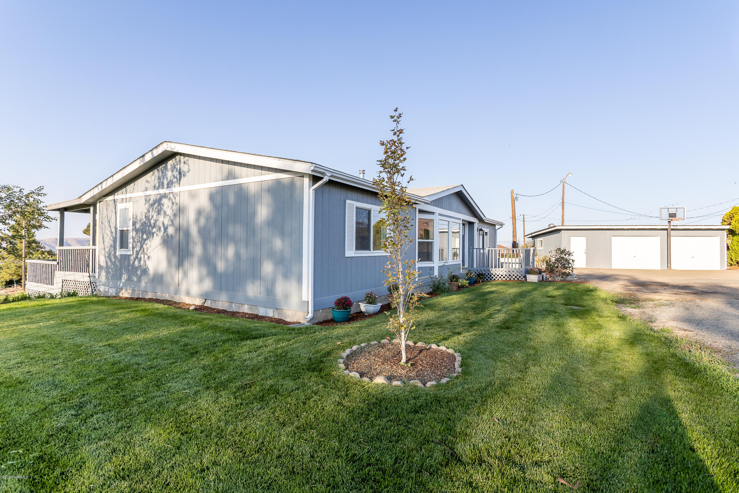 6904 Bittner Road Yakima, WA 98901 - Photo 2 of 29 a house view with a garden space