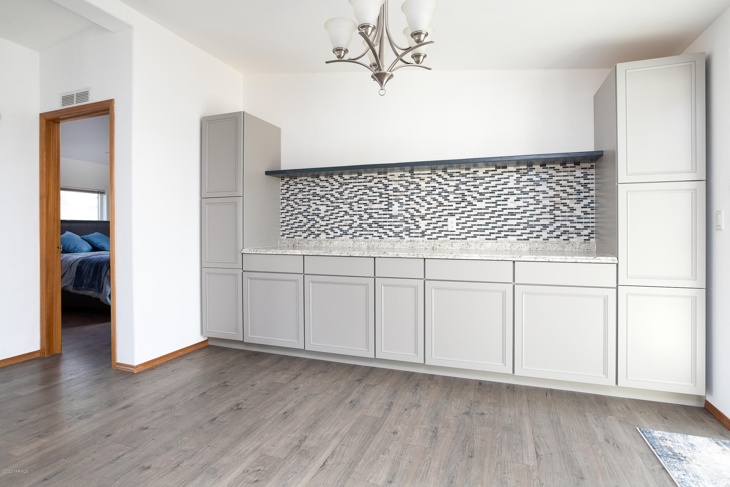 6904 Bittner Road Yakima, WA 98901 - Photo 16 of 29 a view of a kitchen with wooden floor