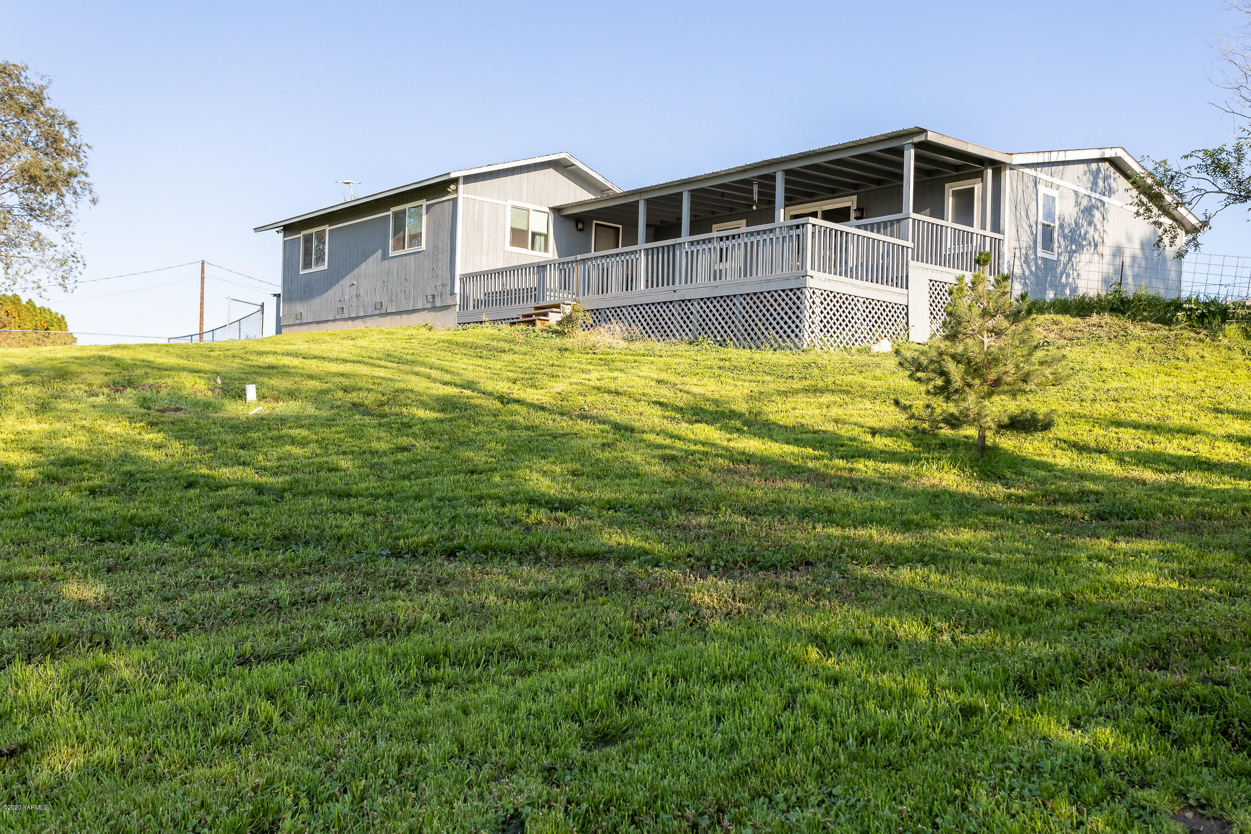 6904 Bittner Road Yakima, WA 98901 - Photo 6 of 29 a front view of house with yard and swimming pool