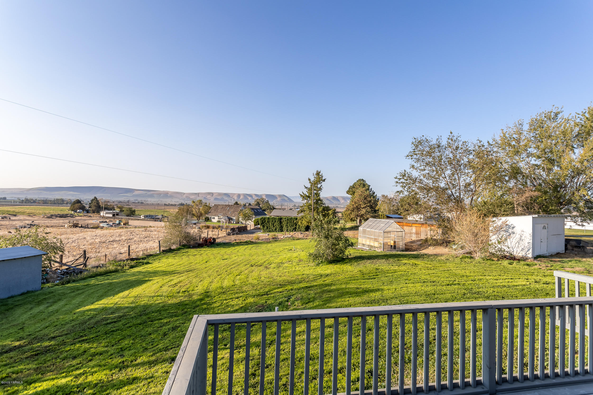 6904 Bittner Road Yakima, WA 98901 - Photo 8 of 29 a view of a swimming pool with an ocean view