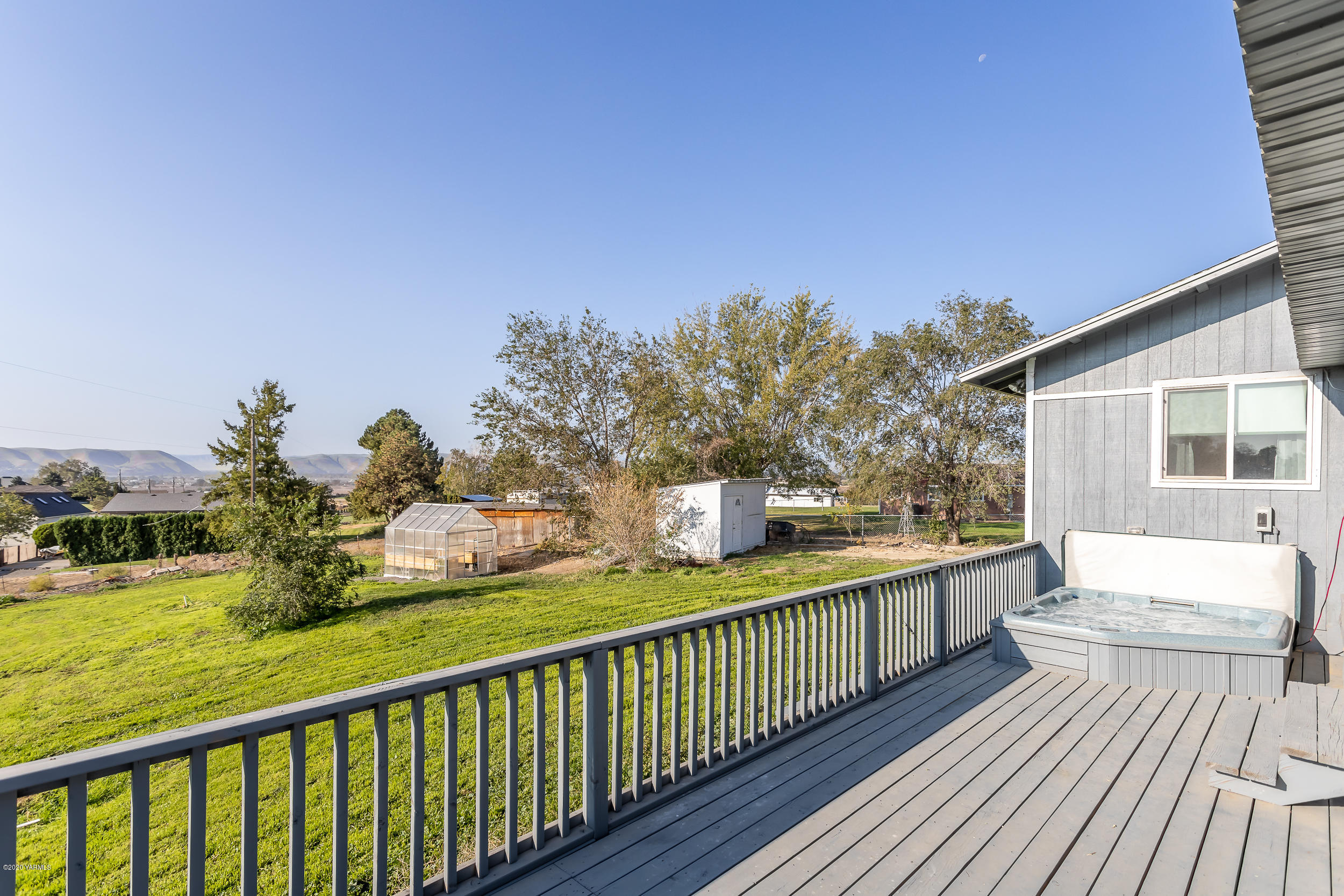 6904 Bittner Road Yakima, WA 98901 - Photo 9 of 29 a balcony with wooden floor and outdoor seating