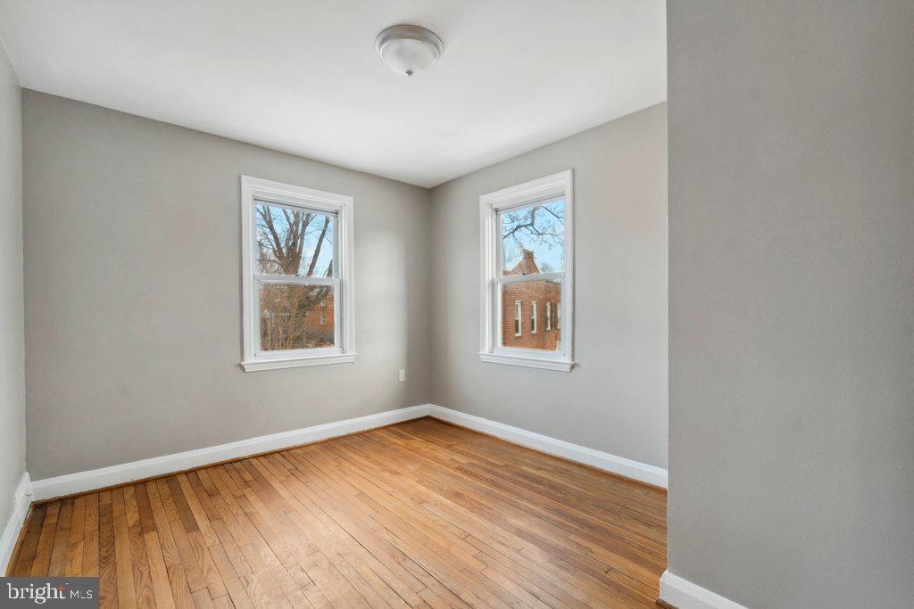 1728 Amuskai Road Baltimore, MD 21234 - Photo 18 of 30 wooden floor in an empty room with a window