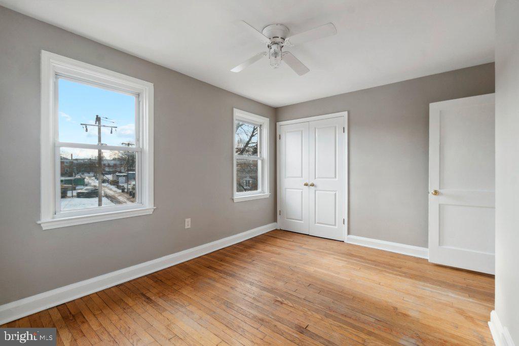 1728 Amuskai Road Baltimore, MD 21234 - Photo 22 of 30 a view of an empty room with window and wooden floor