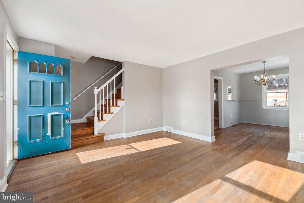 1728 Amuskai Road Baltimore, MD 21234 - Photo 4 of 30 a view of livingroom with hardwood floor and stairs
