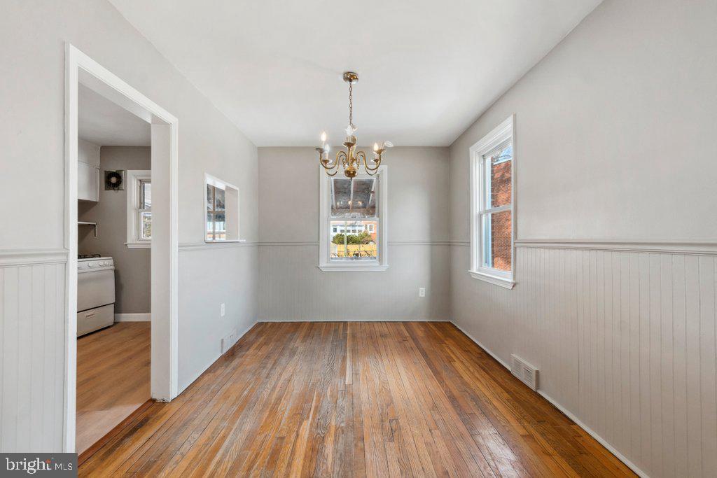1728 Amuskai Road Baltimore, MD 21234 - Photo 7 of 30 wooden floor in an empty room with a window