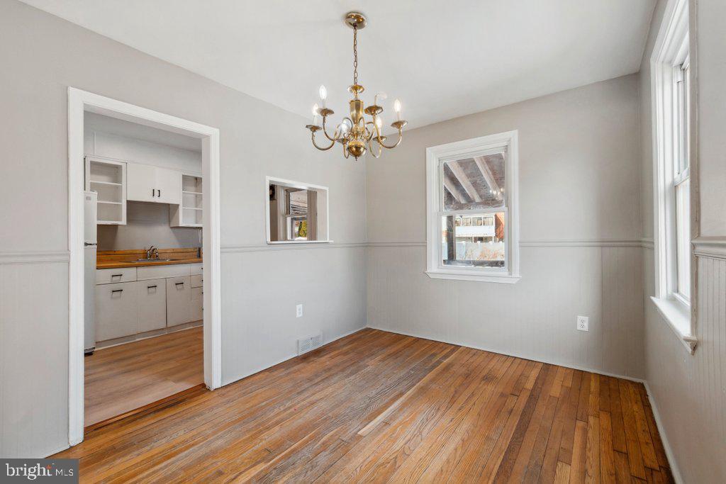 1728 Amuskai Road Baltimore, MD 21234 - Photo 8 of 30 a view of a room with cabinet and wooden floor