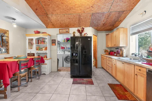 a living room with furniture a fireplace and a table