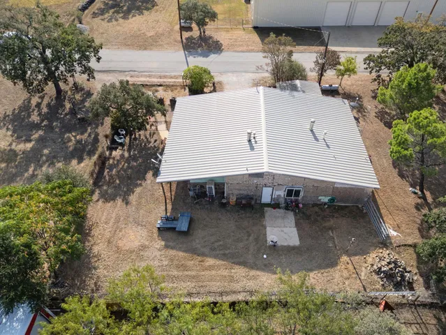a backyard of a house with yard and garage