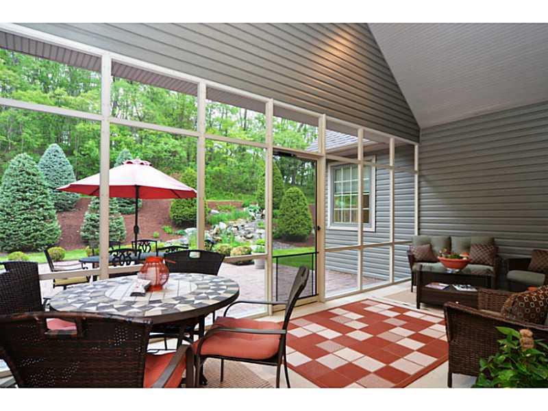1025 Chapel Road Monaca, PA 15061 - Photo 19 of 24 Sunroom. The sun porch is fully screened with a vaulted ceiling and recessed lights.