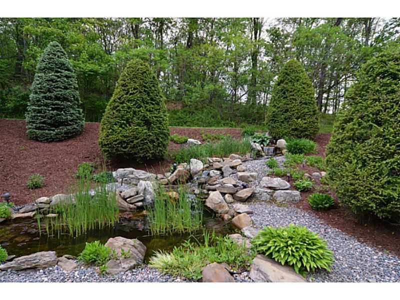 1025 Chapel Road Monaca, PA 15061 - Photo 22 of 24 Yard/Garden. The pond and waterfall create a peaceful and relaxing atmosphere.