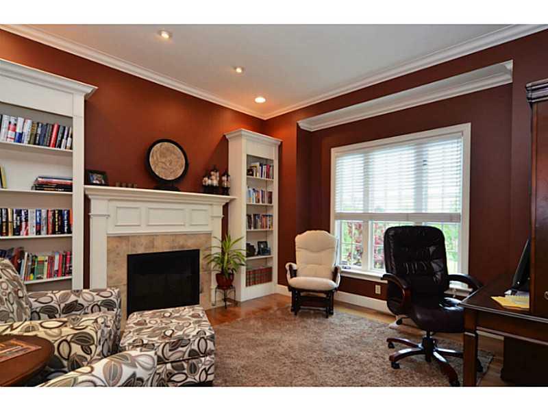 1025 Chapel Road Monaca, PA 15061 - Photo 5 of 24 Den. The den offers a quiet place to work or relax and read. It includes a fireplace, hardwood floors, crown molding, built-in shelving and French doors.