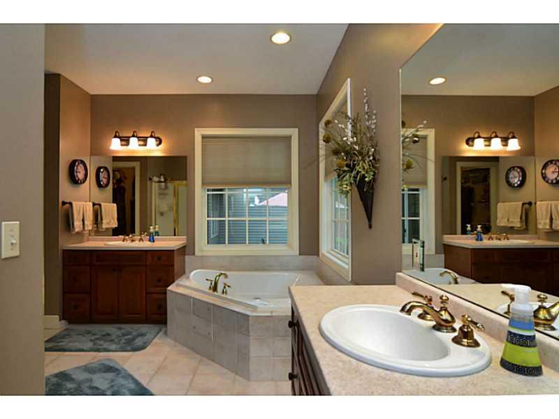1025 Chapel Road Monaca, PA 15061 - Photo 10 of 24 Master Bath/Spa. The master bath offers two vanities, a jacuzzi tub with tile surround, shower and tile floors.