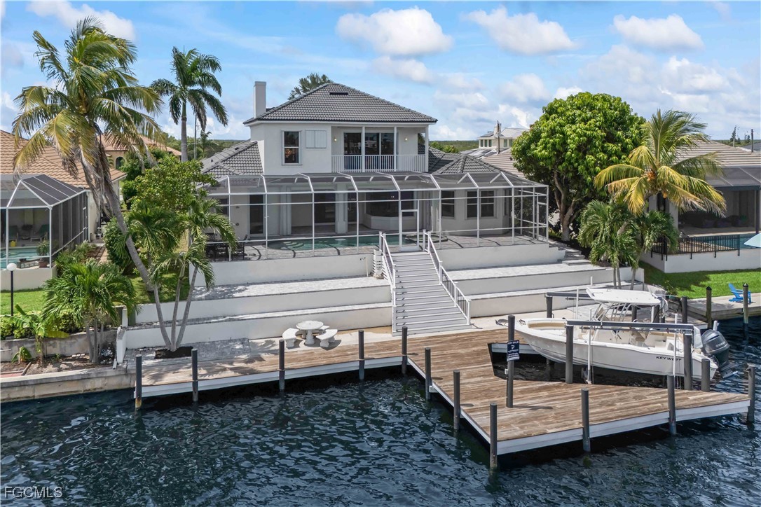 221 Old Burnt Store Road South Cape Coral, FL 33991 - Photo 4 of 49 a view of a house with a yard