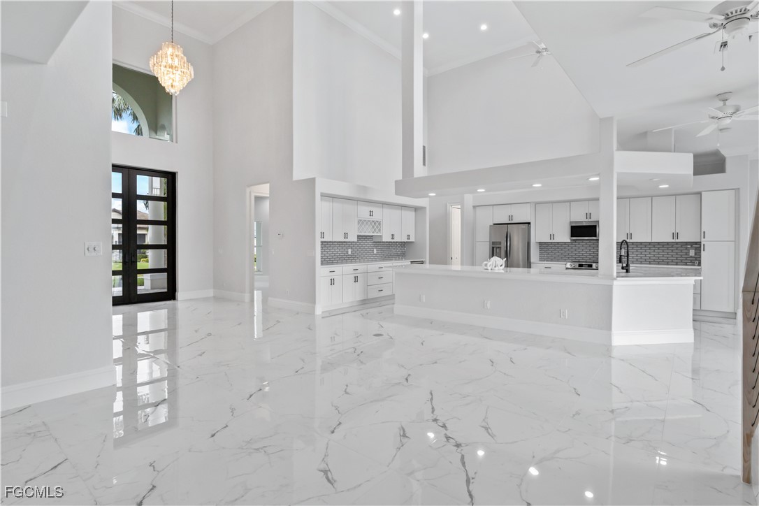 221 Old Burnt Store Road South Cape Coral, FL 33991 - Photo 6 of 49 a view of a kitchen with furniture and a kitchen view